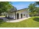 Small white guest house with black doors and windows at 4600 Nebraska Ave, Sanford, FL 32771