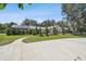 White house with a pool and lush landscaping at 4600 Nebraska Ave, Sanford, FL 32771