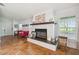 Living room with a fireplace and terracotta tile floors at 4600 Nebraska Ave, Sanford, FL 32771