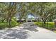 Long driveway leading to a house, framed by lush, oak trees with Spanish moss at 4600 Nebraska Ave, Sanford, FL 32771