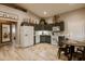 Charming kitchen with gray cabinets, white appliances, and farmhouse decor at 4600 Nebraska Ave, Sanford, FL 32771
