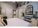 Bright bedroom with white bed, built-in shelving, and a large mirror at 4600 Nebraska Ave, Sanford, FL 32771