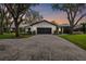 House exterior at dusk, featuring a two-car garage and manicured lawn at 4600 Nebraska Ave, Sanford, FL 32771