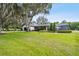 White house with a screened-in pool area at 4600 Nebraska Ave, Sanford, FL 32771