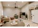 Open living room with a round dining table and vaulted ceiling at 4600 Nebraska Ave, Sanford, FL 32771