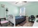 Cozy bedroom with a ceiling fan and a full-sized bed at 5251 Bear Corn Run, Port Orange, FL 32128
