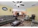Open concept living room with a view into the kitchen and dining area at 5251 Bear Corn Run, Port Orange, FL 32128