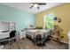 Charming bedroom with a cat tree and plenty of natural light at 5251 Bear Corn Run, Port Orange, FL 32128