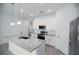 Modern kitchen with white cabinets and granite countertops at 2659 Trafalgar Blvd, Kissimmee, FL 34758
