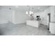 Modern kitchen with white cabinets, granite counters, and island at 2659 Trafalgar Blvd, Kissimmee, FL 34758