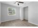 Bright bedroom with hardwood floors and a spacious closet at 4465 Kirkland Blvd, Orlando, FL 32811