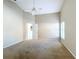 Bright Primary bedroom with carpet, ceiling fan and access to kitchen at 466 Lancers Dr, Winter Springs, FL 32708