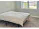 Simple bedroom with a bed and window at 124 Cerise Ct, Daytona Beach, FL 32124