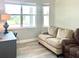 Home office with a couch and large windows at 124 Cerise Ct, Daytona Beach, FL 32124