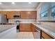 Modern kitchen with stainless steel appliances and granite countertops at 5102 Caspian St, Saint Cloud, FL 34771