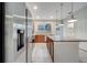 Kitchen with stainless steel appliances and granite island at 5102 Caspian St, Saint Cloud, FL 34771