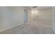 Upstairs hallway with carpet and access to bedrooms at 5102 Caspian St, Saint Cloud, FL 34771