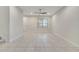 Spacious living room with tile floors and window at 5102 Caspian St, Saint Cloud, FL 34771