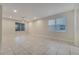 Living room with tile floors and large window at 5102 Caspian St, Saint Cloud, FL 34771