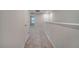 Upstairs hallway with carpet and doors to bedrooms at 5102 Caspian St, Saint Cloud, FL 34771