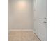 Small entryway with tile floors and white door at 5102 Caspian St, Saint Cloud, FL 34771