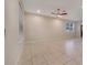 Bright living room with tile floors and ceiling fan at 5102 Caspian St, Saint Cloud, FL 34771