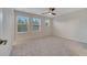 Large bedroom with three windows and ceiling fan at 5102 Caspian St, Saint Cloud, FL 34771
