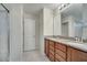Double vanity bathroom with granite countertop at 5102 Caspian St, Saint Cloud, FL 34771
