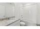 Clean bathroom with bathtub, shower, and granite countertop at 2727 Virginia Pine Dr, Bartow, FL 33830