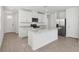 Open concept kitchen with island, granite countertops, and stainless steel appliances at 2727 Virginia Pine Dr, Bartow, FL 33830