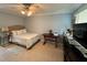 Main bedroom with a queen-size bed and TV at 5135 Warrior Ln, Kissimmee, FL 34746