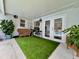 Relaxing patio area with artificial turf and seating at 5135 Warrior Ln, Kissimmee, FL 34746