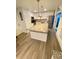 Modern kitchen with white cabinets, granite island, and stainless steel appliances at 5135 Warrior Ln, Kissimmee, FL 34746