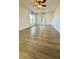 Spacious living room with wood-look flooring at 5135 Warrior Ln, Kissimmee, FL 34746