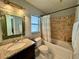 Bathroom with granite countertop and bathtub at 5135 Warrior Ln, Kissimmee, FL 34746