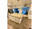 Kitchen boasts a large island, granite countertops, and views of the pool and patio at 5135 Warrior Ln, Kissimmee, FL 34746