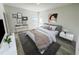 Spacious bedroom featuring a king-size bed and ample natural light at 14954 Sw 38Th Cir, Ocala, FL 34473