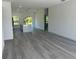 Spacious living room with luxury vinyl plank flooring and an open floor plan at 14954 Sw 38Th Cir, Ocala, FL 34473