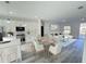 Open concept kitchen and living area with modern appliances and a dining table at 14954 Sw 38Th Cir, Ocala, FL 34473