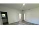 Main bedroom with wood-look floors and en-suite bathroom at 14954 Sw 38Th Cir, Ocala, FL 34473