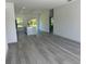 Spacious living room with luxury vinyl plank flooring and an open floor plan at 14954 Sw 38Th Cir, Ocala, FL 34473