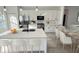Modern kitchen with white cabinets, stainless steel appliances, and an island at 14954 Sw 38Th Cir, Ocala, FL 34473