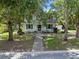 Front view of a two-story house with a walkway and mailbox at 1803 E Kaley Ave, Orlando, FL 32806