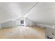 Unfinished attic space with built-in shelving unit at 1803 E Kaley Ave, Orlando, FL 32806
