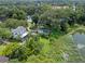 Aerial view showing a house and large lot near a lake at 1803 E Kaley Ave, Orlando, FL 32806