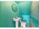 Small bathroom with pedestal sink and flamingo mural at 1803 E Kaley Ave, Orlando, FL 32806