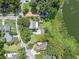 Aerial view of property and surrounding area near lake at 1803 E Kaley Ave, Orlando, FL 32806