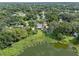 Aerial view of property on waterfront lot, near a lake at 1803 E Kaley Ave, Orlando, FL 32806