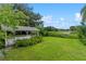 White shed in backyard with green lawn and lake view at 1803 E Kaley Ave, Orlando, FL 32806
