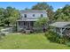 House with a large backyard, detached structure, and porch at 1803 E Kaley Ave, Orlando, FL 32806